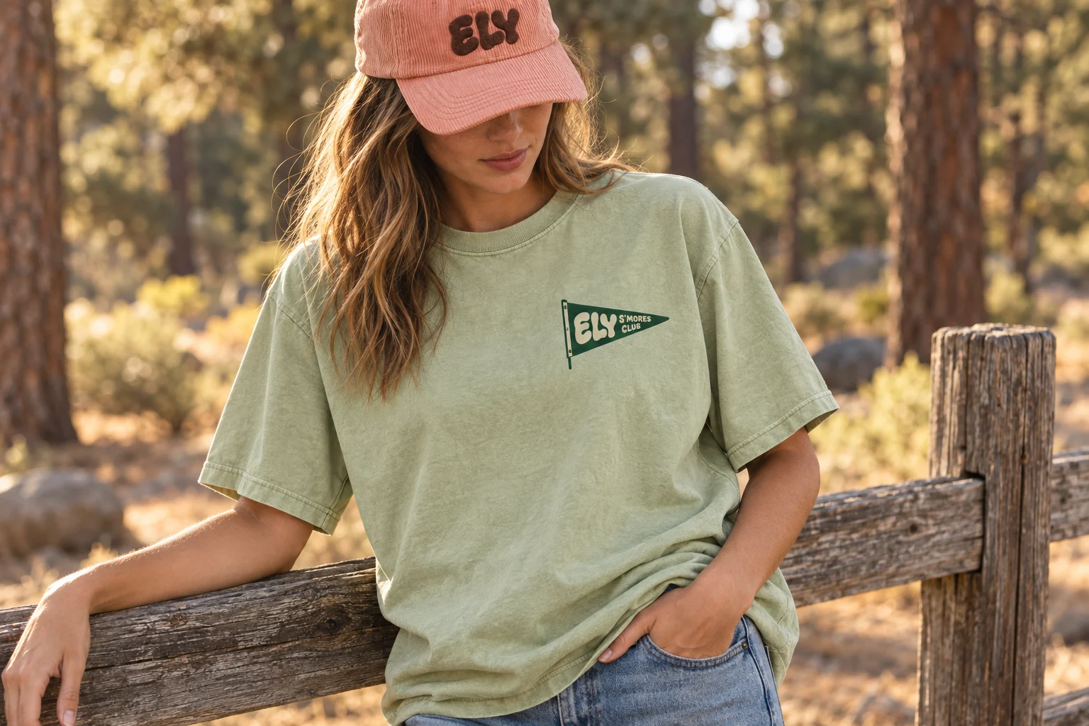 Oversized pistachio tee with a small ELY S’mores Club pennant at the chest